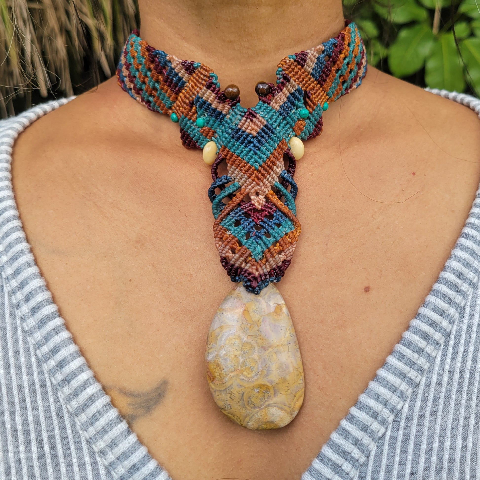 Handmade fossilized coral pendant on tribal macramé choker