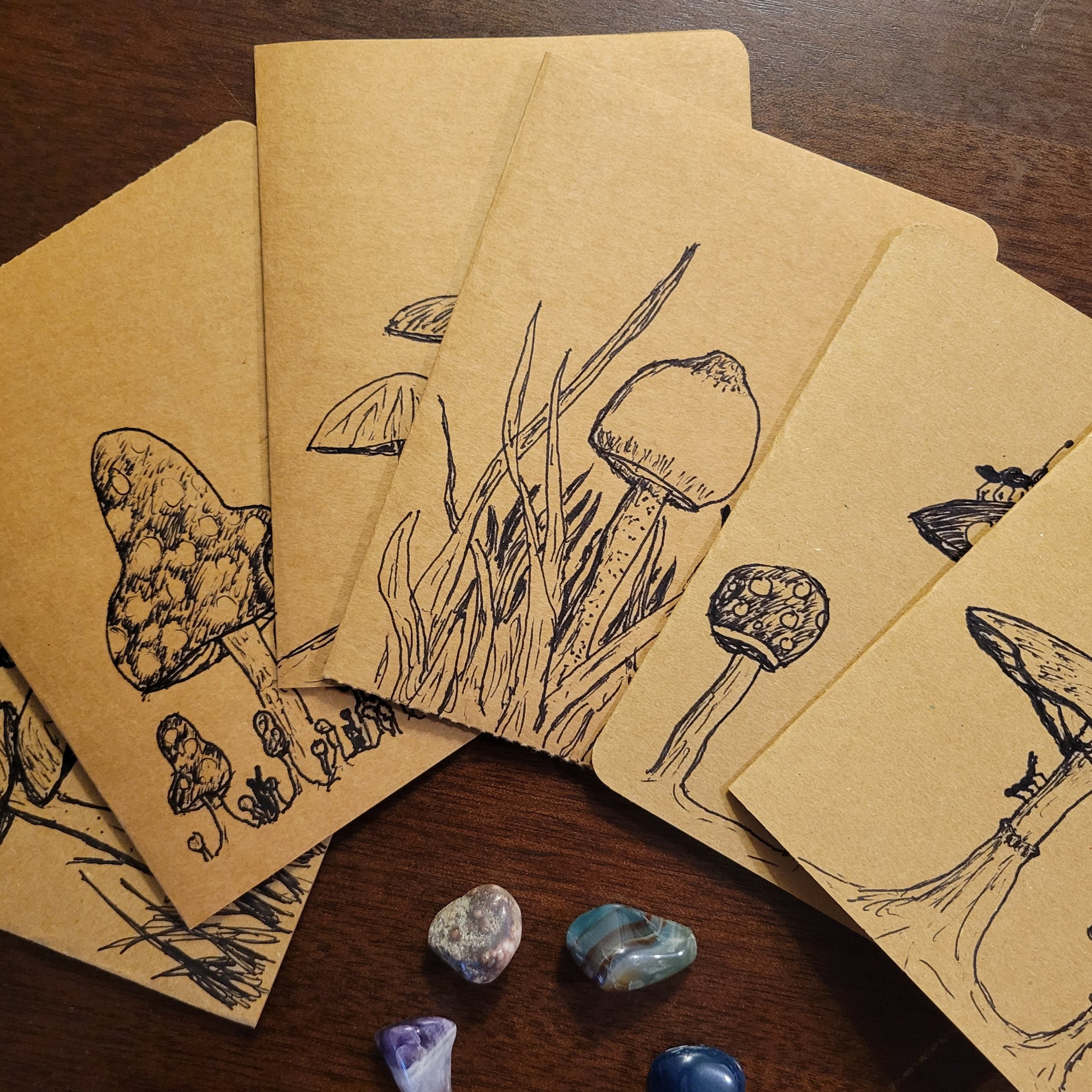 Handmade Cards featuring original illustrations of mushrooms from the Fungal Ant Series on kraft paper.