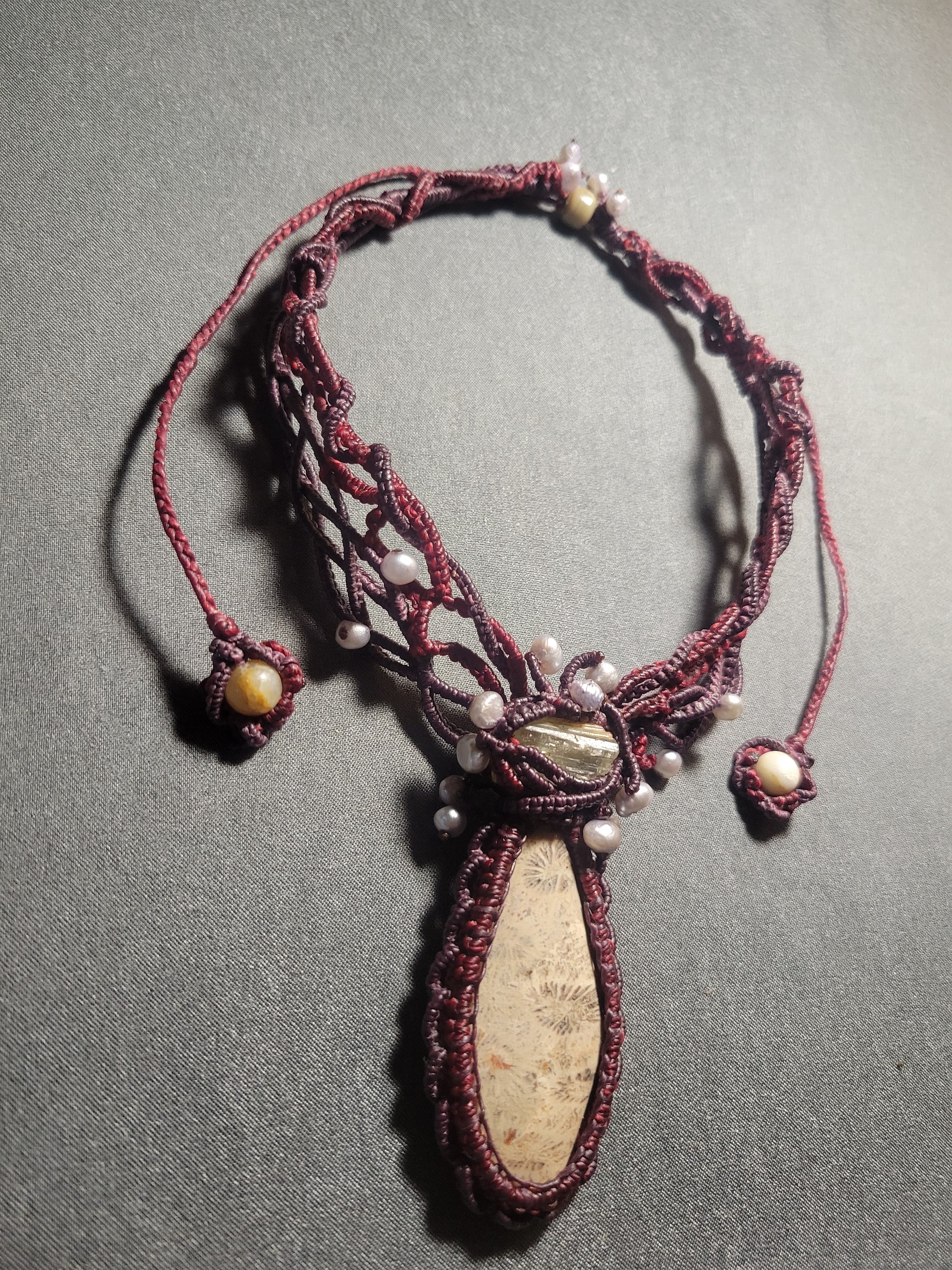 Close up of fossil coral pendant choker
