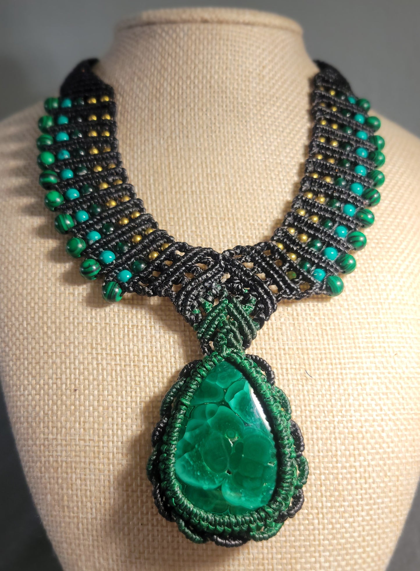 Malachite pendant necklace with concentric green rings