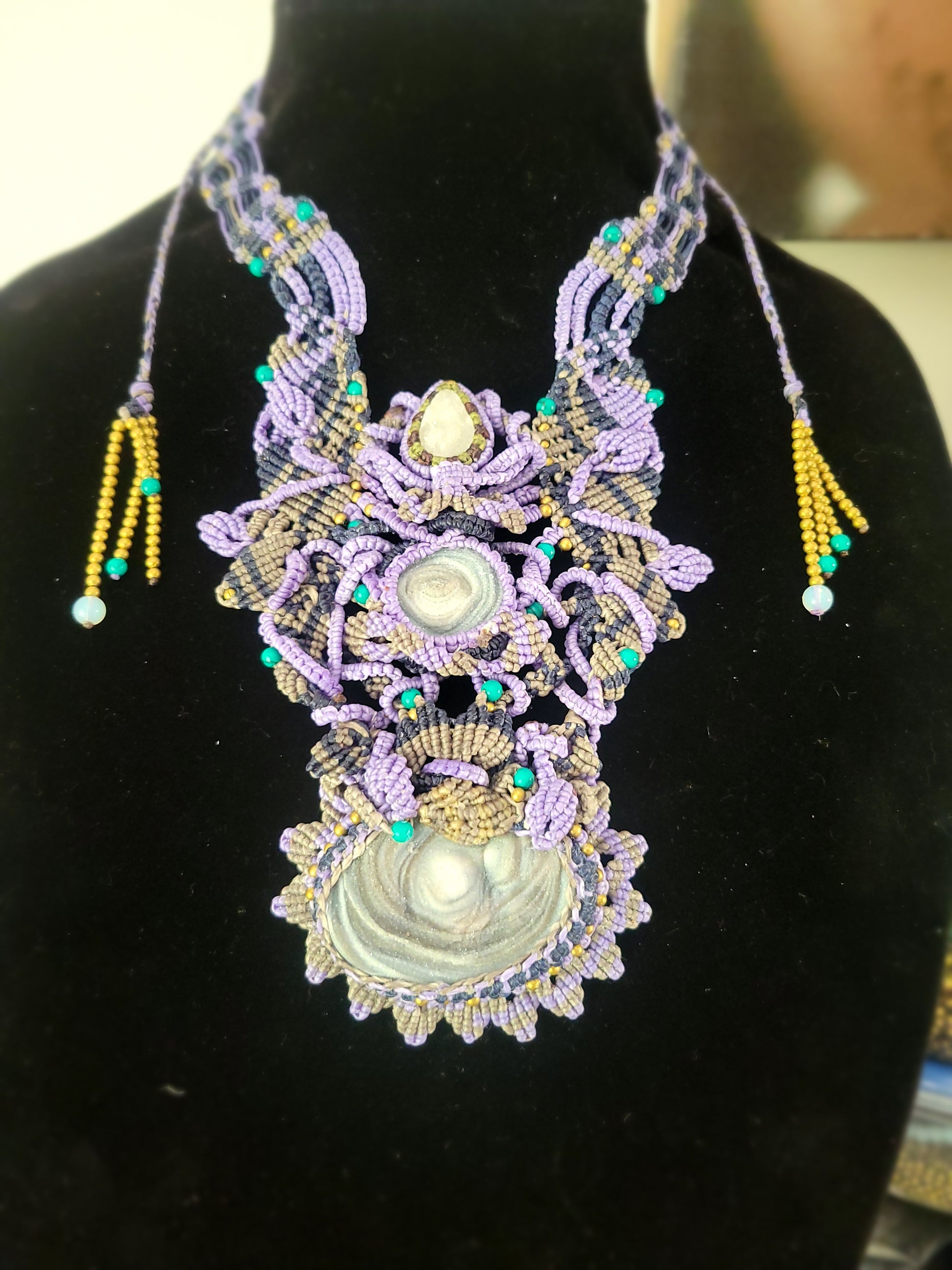 Agate Necklace featuring triple druzy agate stones, boho breastplate design with macramé cords and brass accents.