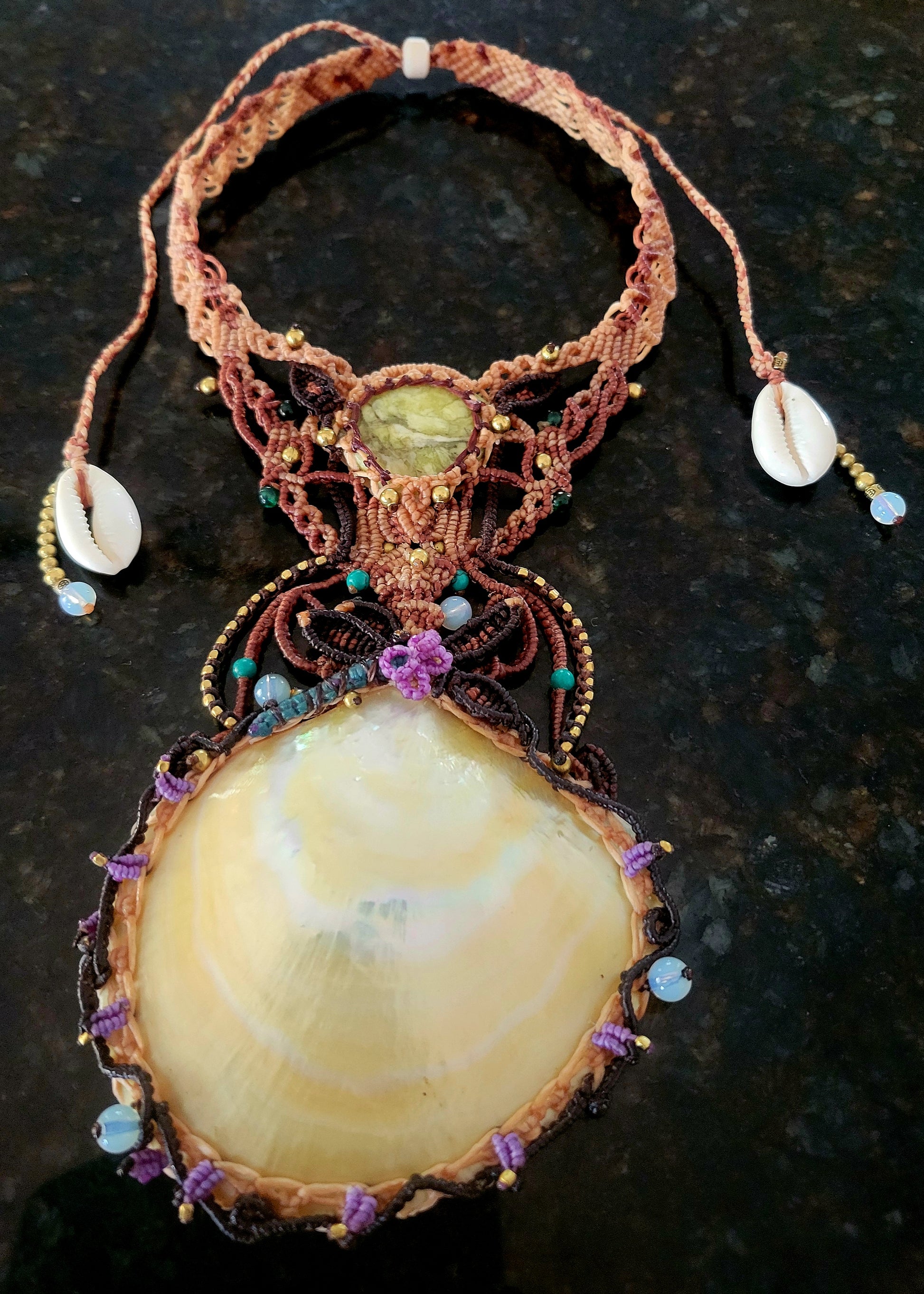 Mother of Pearl Shell Necklace featuring a large luminous pendant and serpentine gemstone accents.