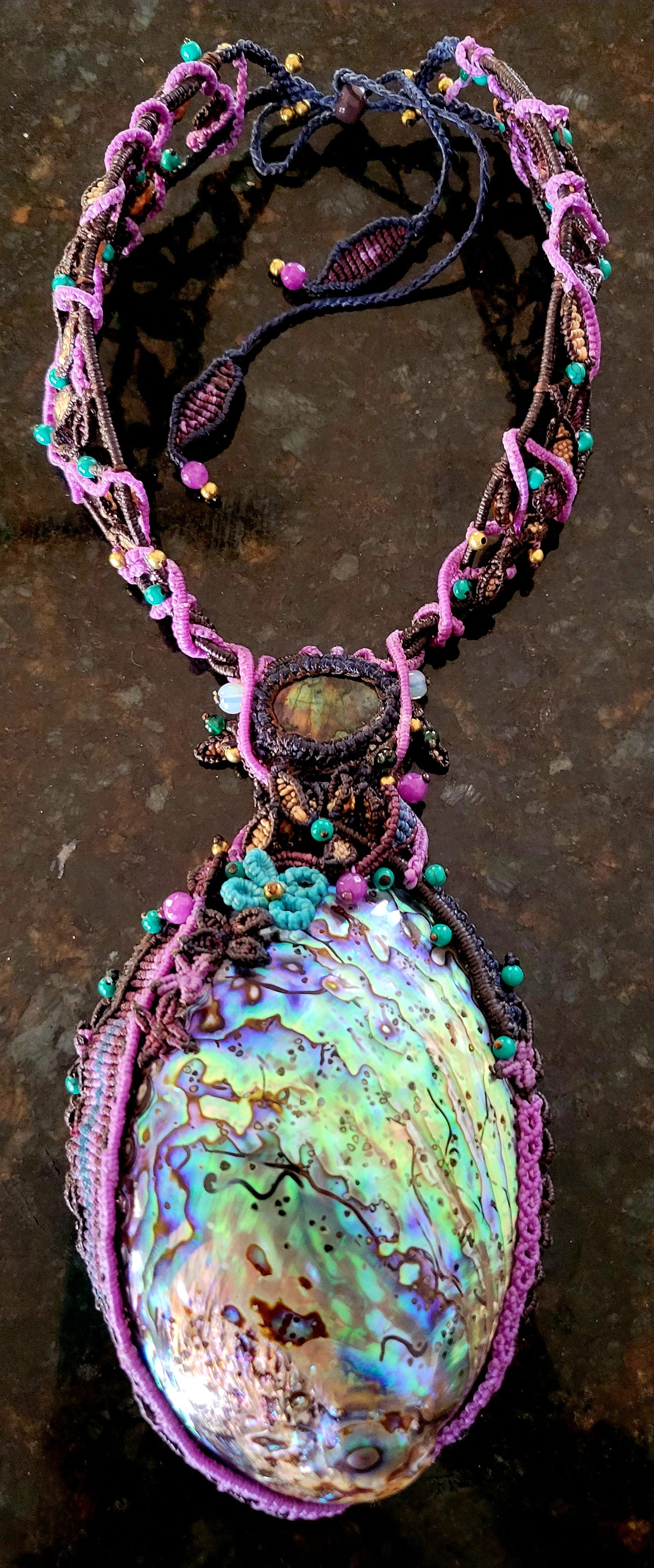 Ocean Necklace featuring a large iridescent Australian abalone shell and handwoven micromacramé design.