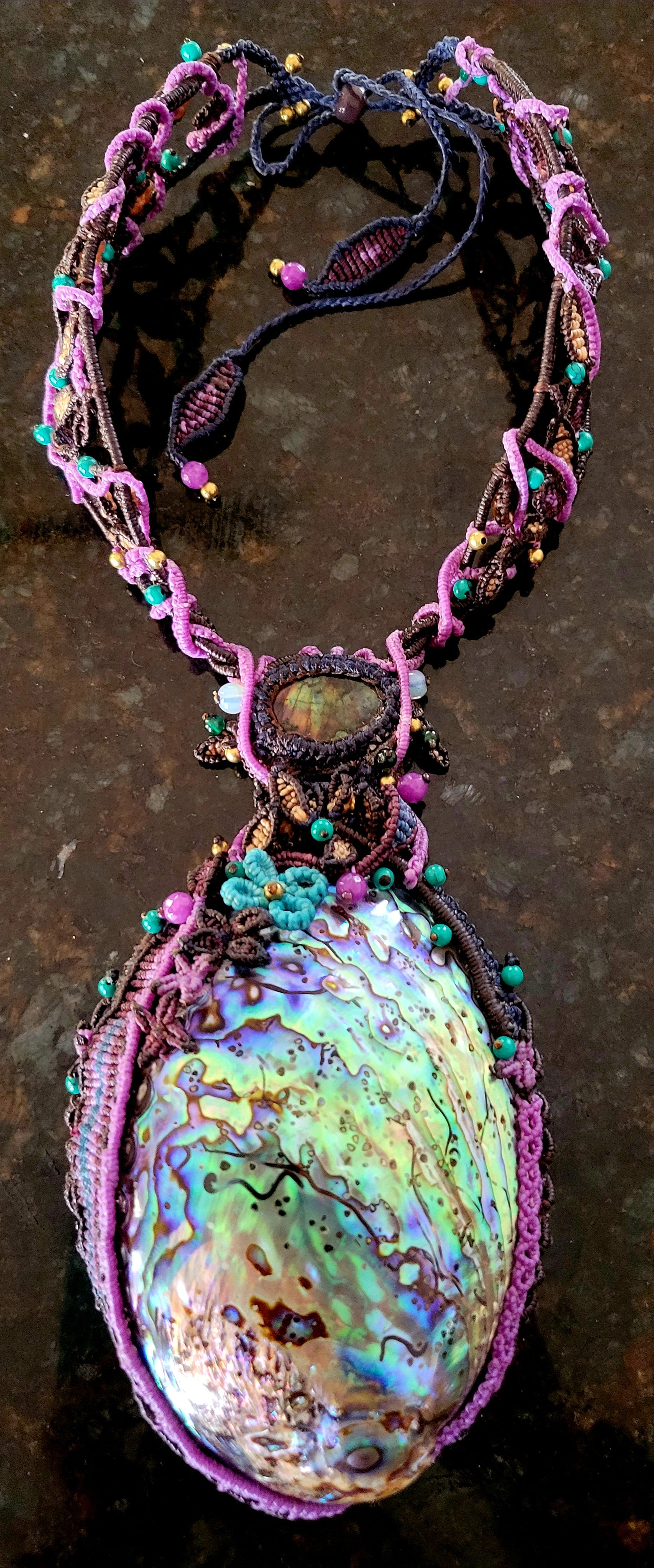 Ocean Necklace featuring a large iridescent Australian abalone shell and handwoven micromacramé design.