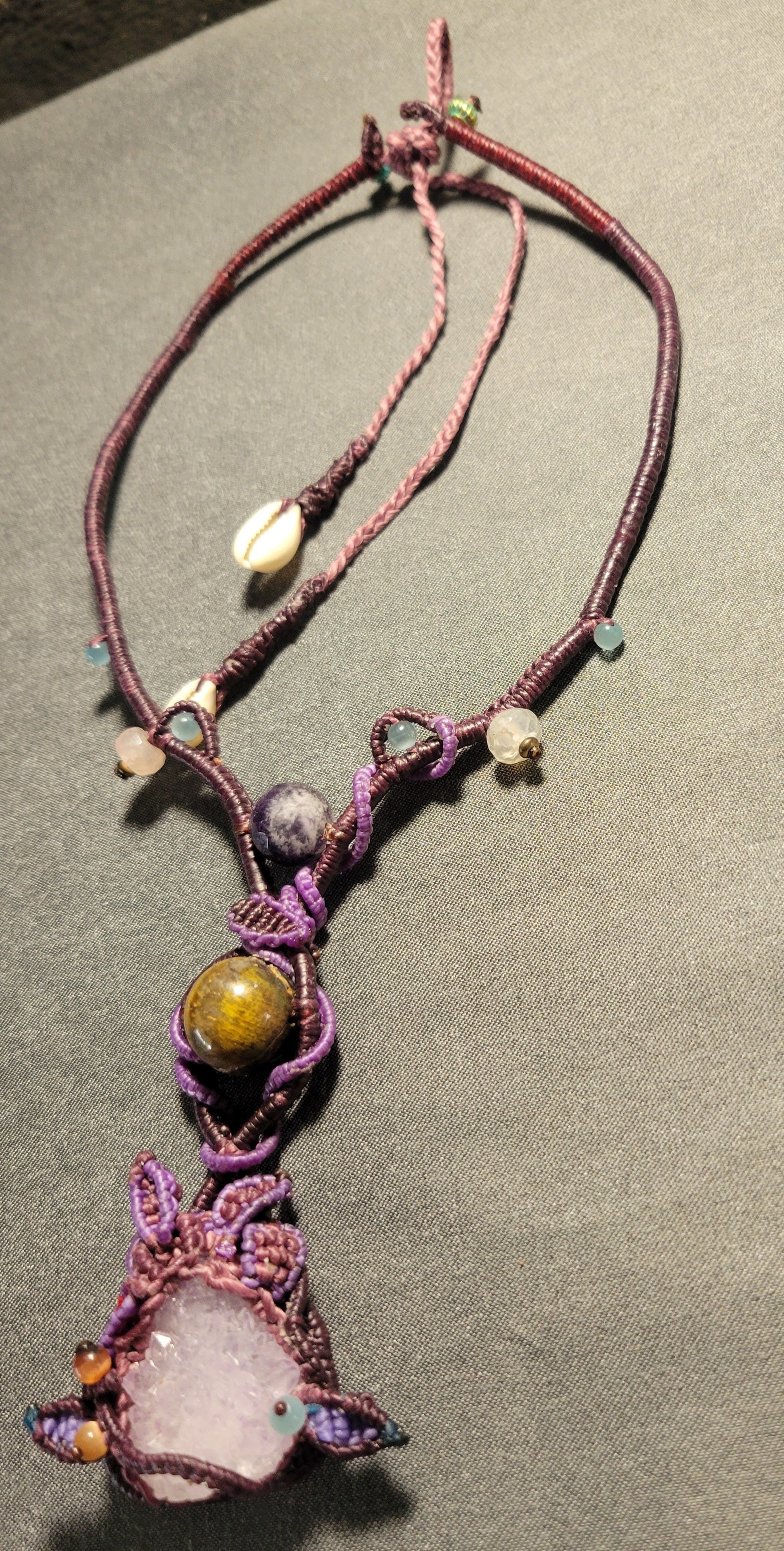 Amethyst Crystal Necklace – Dancing Energy Talisman with raw amethyst, tiger eye, and macramé design.