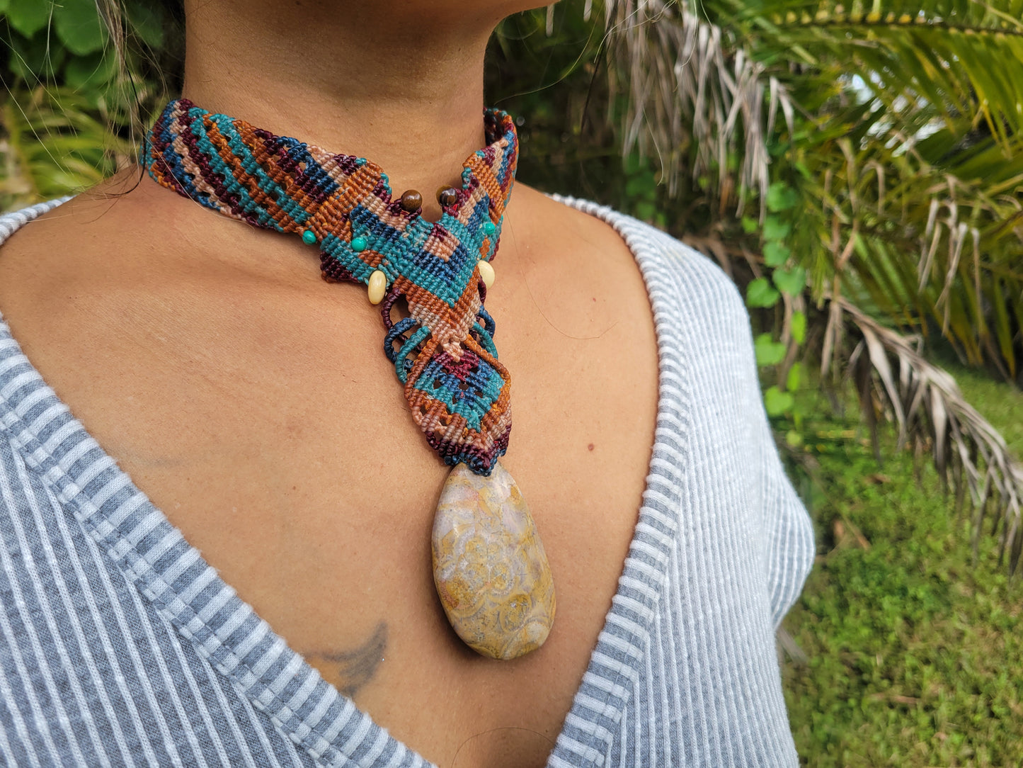 Boho coral jewelry with white and orange fossil centerpiece