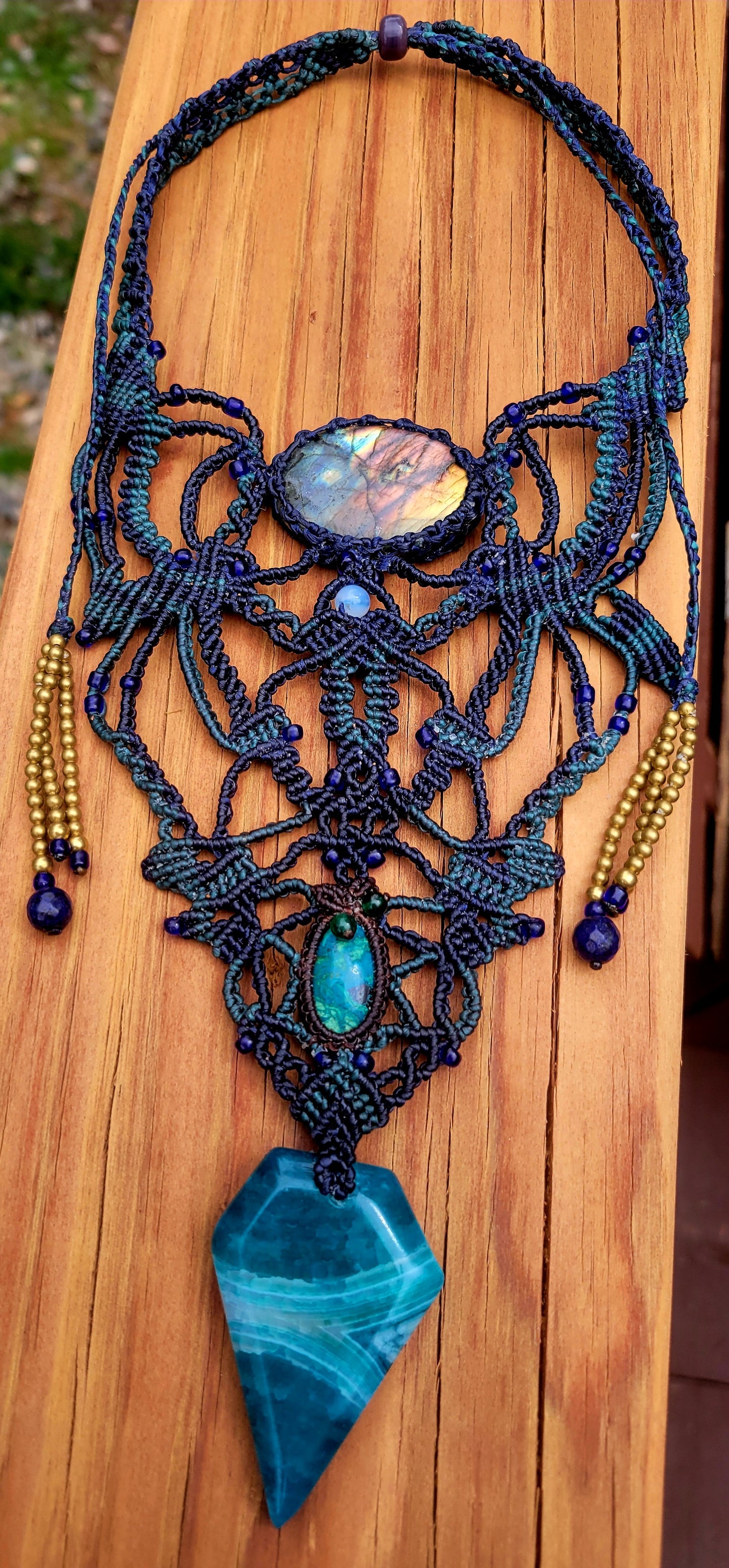 Labradorite & Blue Agate Pendant featuring micromacramé design and vibrant gemstones, showcasing an ethereal fairy-like appearance.