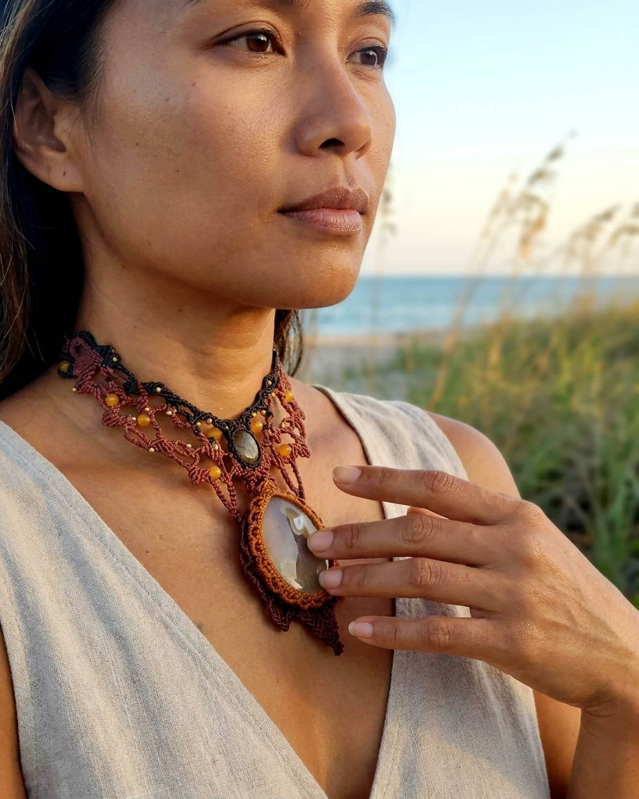 Agate Pendant worn by a woman, showcasing a macramé design inspired by ocean life and sea turtles.