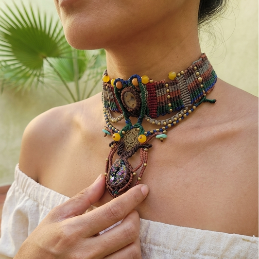 Titanium Aura Pendant worn as a sacred geometry spiritual choker with colorful micromacramé design and unique accents.