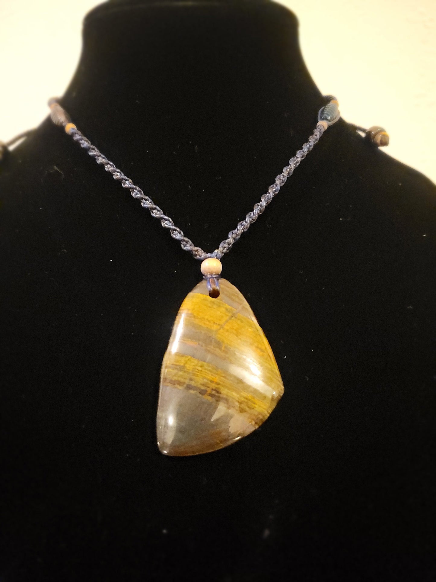 “Strength in Stillness” – Iron Tiger Eye Pendant Necklace, Blue Cord with Clear Quartz Beads, Adjustable