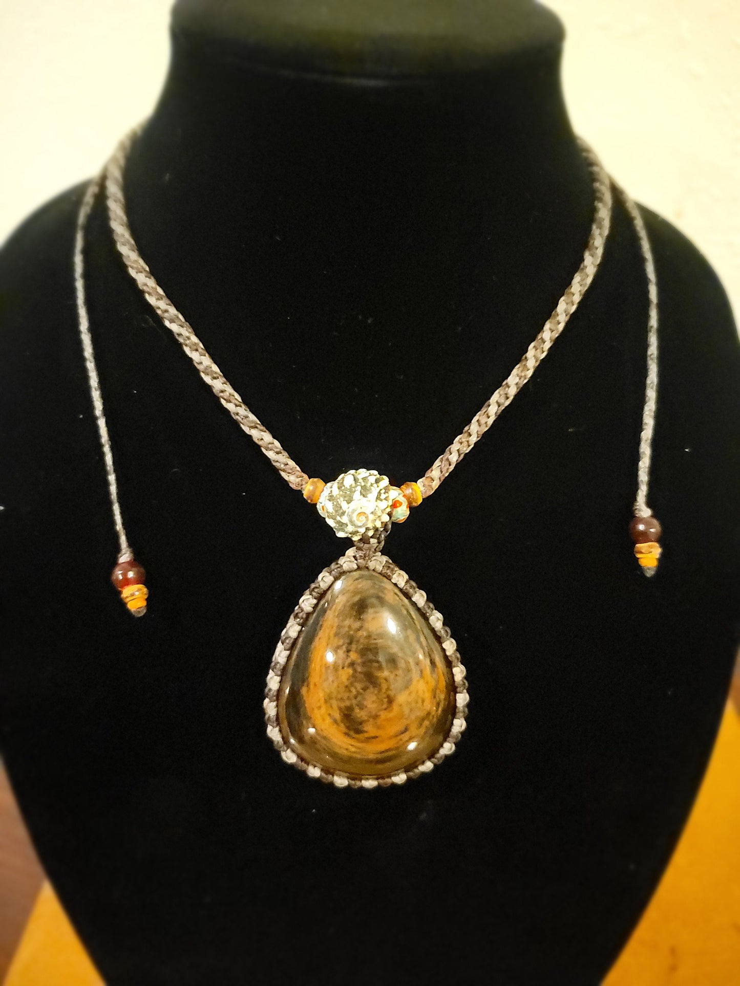 “Roots & Tides” – Mahogany Obsidian Pendant Necklace with Spiral Shell and Stone Beads, Adjustable Earth-Tone Cord