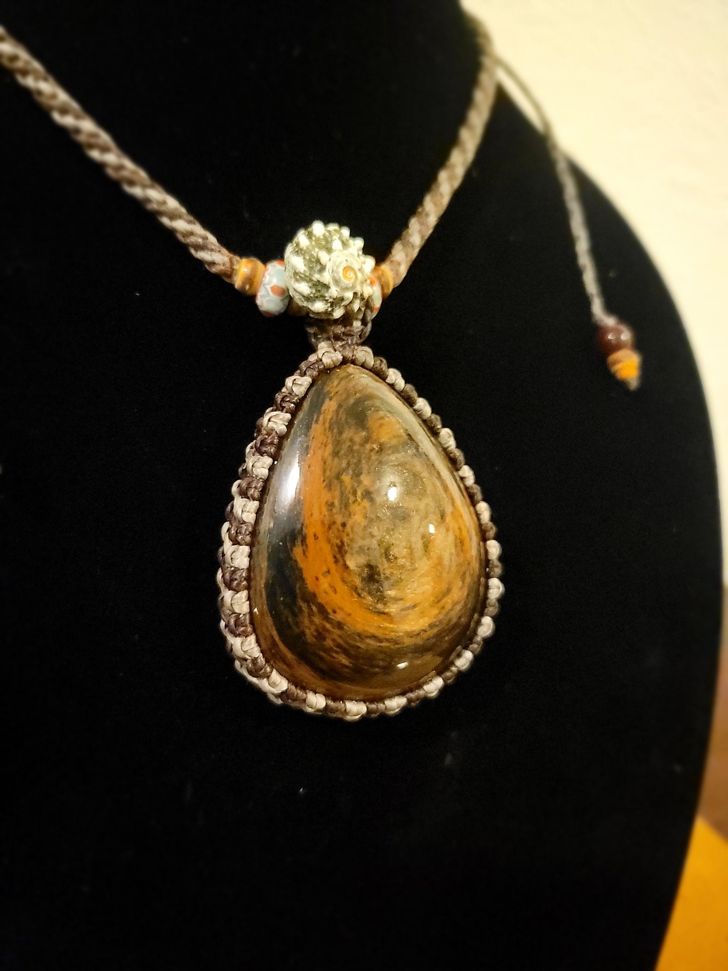 “Roots & Tides” – Mahogany Obsidian Pendant Necklace with Spiral Shell and Stone Beads, Adjustable Earth-Tone Cord